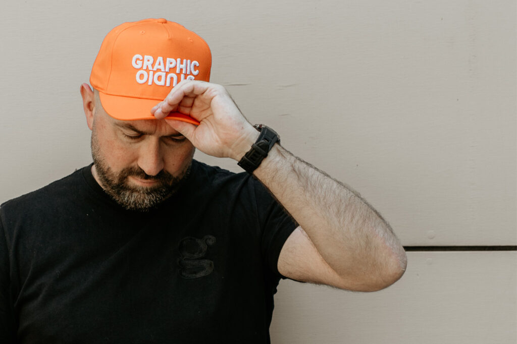 Gareth rearranging orange cap